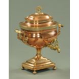 A 19th century copper and brass Samovar, of typical form raised on short ball feet, width 36 cm.