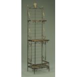 A French iron bakers rack, with wheatsheaf pediment and three open tiers, height 210 cm,