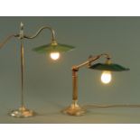 Two industrial table lamps, each with a green and white enamel shade with adjustable branches,