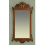 A George III mahogany fretwork wall mirror, fretwork head and foot and original mirror glass,