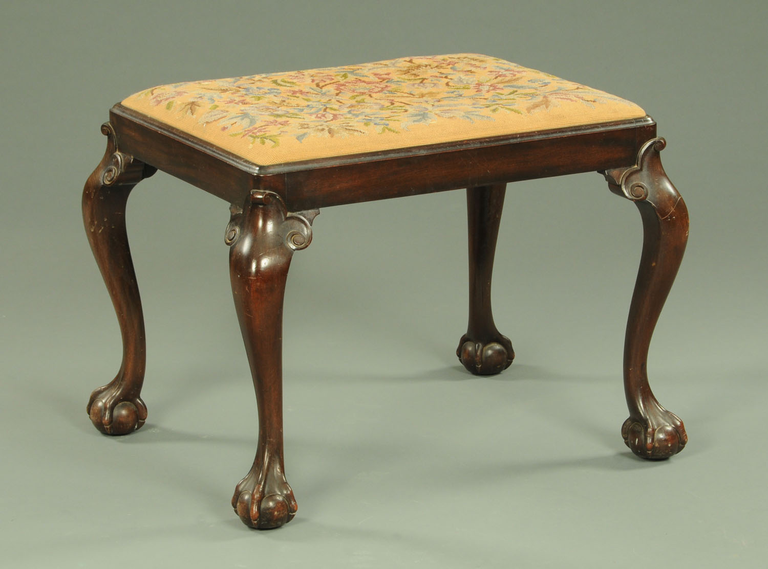 A mahogany Queen Anne style footstool, circa 1930,