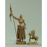 Two 19th century spelter figures of Joan of Arc, one standing holding aloft a banner,