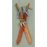 A pair of Masai short swords, each in leather scabbard with beadwork hanger, 1950's, length 57 cm.