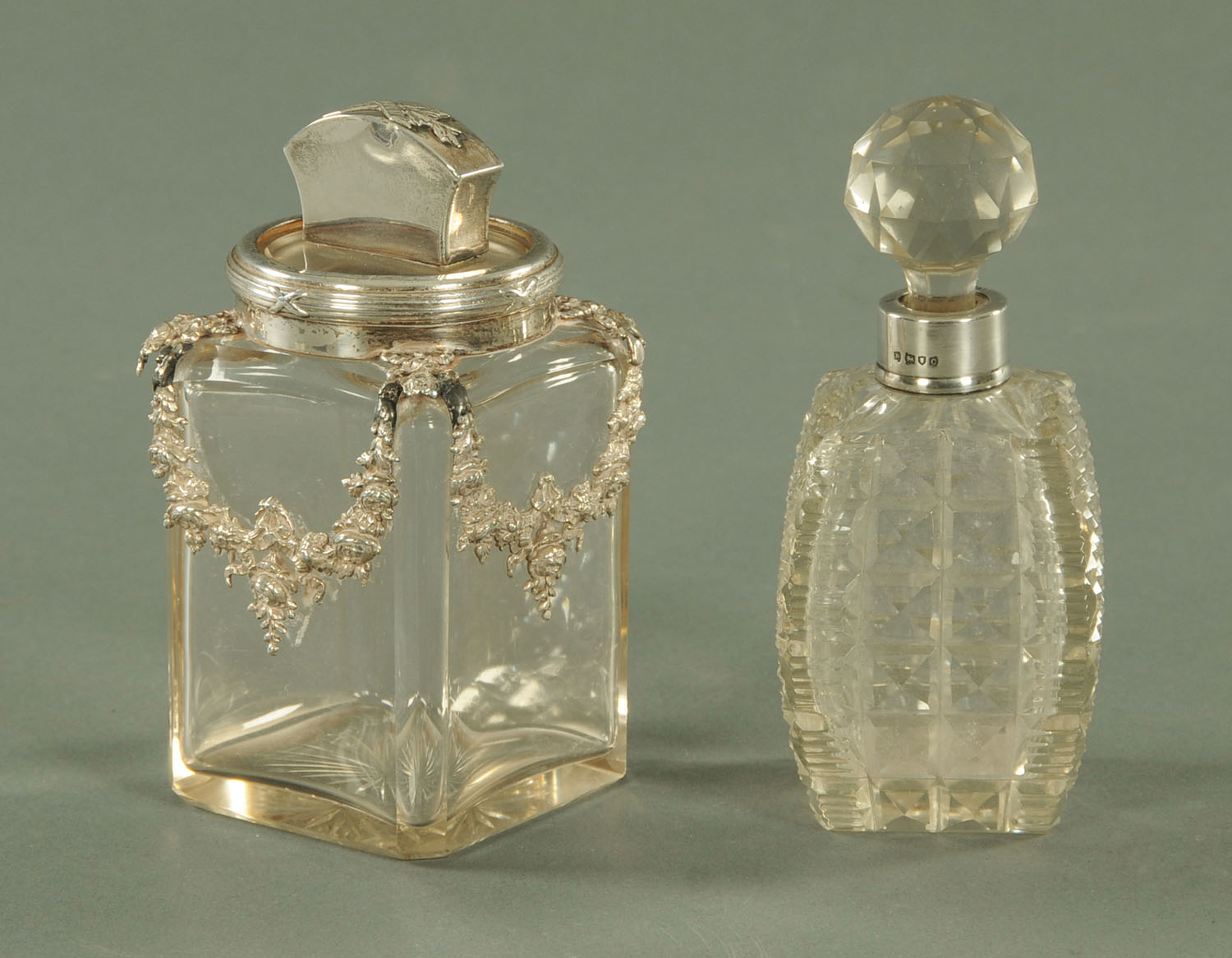 A cut glass scent bottle with silver mount,