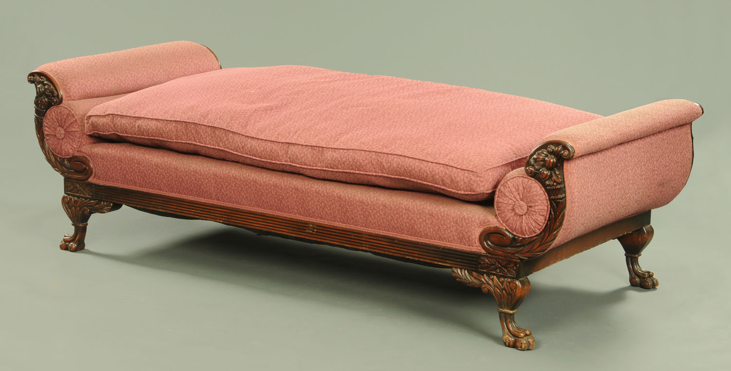 A 19th century mahogany daybed, with exposed cornucopia and foliate carved moulded showframe,