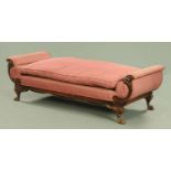 A 19th century mahogany daybed, with exposed cornucopia and foliate carved moulded showframe,