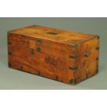 A 19th century camphorwood chest, with metal bound corners and iron carrying handle to either side.