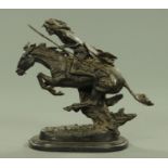 After Frederick Remington, a bronze native American Indian on horseback,