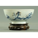 A Nanking Cargo blue and white bowl, circa 1752, with traces of enamelled decoration,