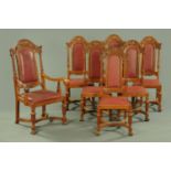 A set of eleven Edwardian oak dining chairs, one arm and ten single,