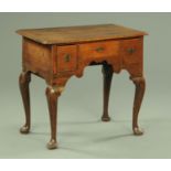 A George III oak lowboy,