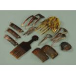 A quantity of tortoiseshell and simulated tortoiseshell hair slides etc.