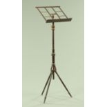 A 19th century Wheeldon's type stained and turned wood adjustable music stand,