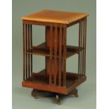 An Edwardian mahogany and crossbanded revolving bookcase,
