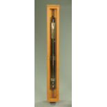 A mercury stick barometer with thermometer,
