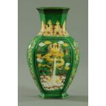 A Chinese biscuit porcelain hexagonal vase, 19th century, the shoulder decorated with stiff leaves,