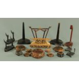 A collection of Oriental carved hardwood stands, for plates and vases,