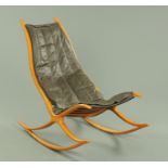 A Danish teak rocking chair, with upholstered leather removable seat, 55 cm wide, 89 cm high,