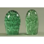 Two Wakefield green glass dumps, 19th century, each with interior air bubble decoration.
