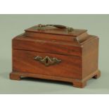 A small Georgian style mahogany tea caddy, with painted brass carrying handle and escutcheon,