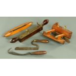 A vintage bronze and mahogany moulding plane, another plane and three wood working tools,