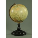 A Philip's 9" terrestrial globe, on turned ebonised stand. Overall height 42 cm.