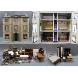 A 3 story wooden dolls house, "The Manor", having grey painted body, slate effect roof,