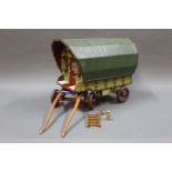 A miniature scratch built wooden gypsy cart, painted in green & red,