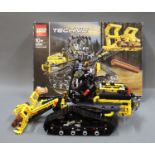 A boxed and assembled Lego Technic Tracked Loader (No.