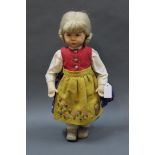 A German Kathe Kruse collector's doll, having bavarian outfit, muslin body, painted features,