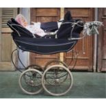 A 1970's coach built Silver Cross twin doll's pram, having two folding sun canopies,