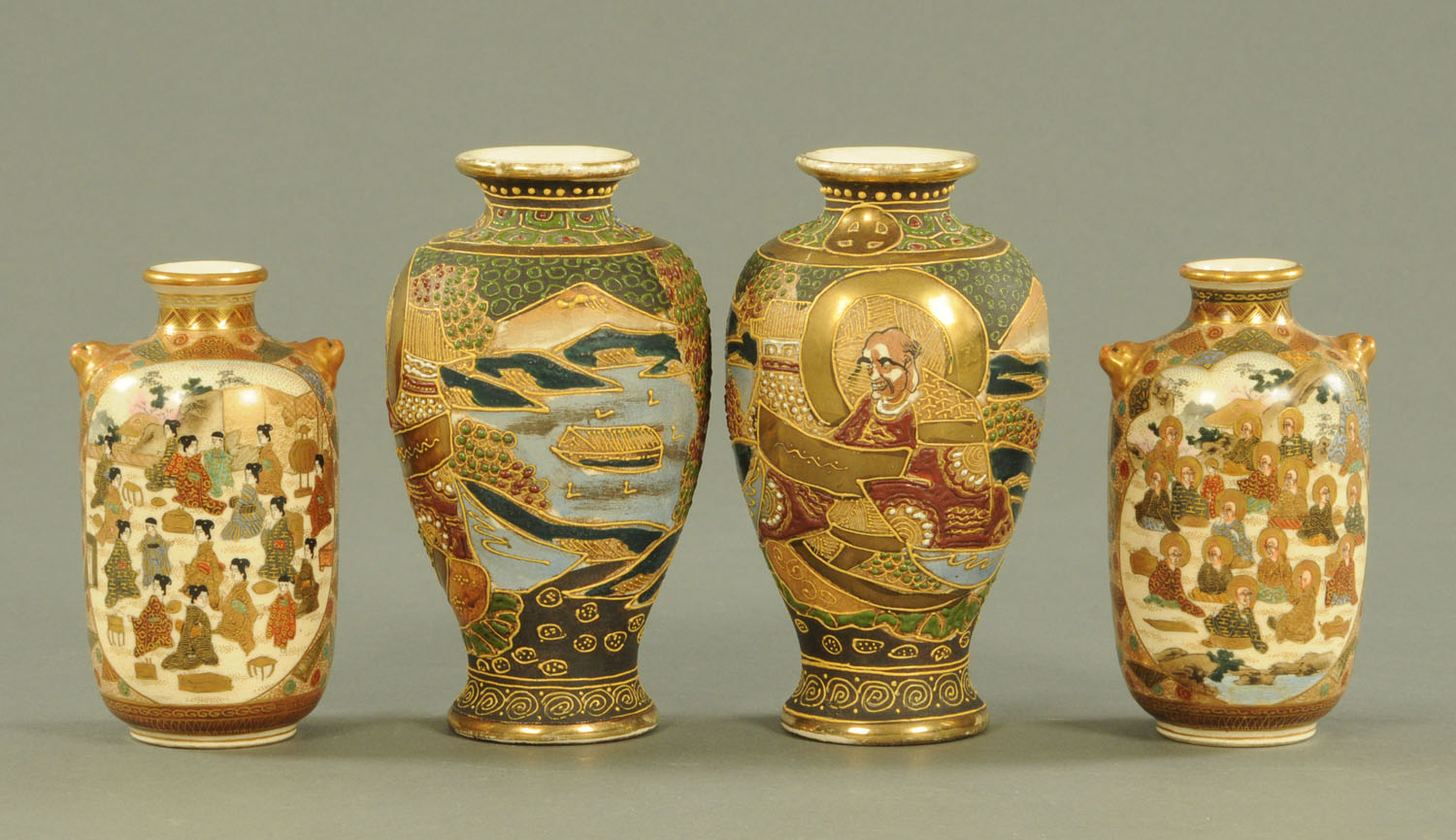 A pair of Japanese Satsuma vases, Meiji period, decorated with panels of Arhats and Bijin,
