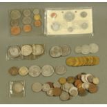 A Canadian 1965 silver coin set, two Canadian silver dollars, four Eisenhower American dollars,