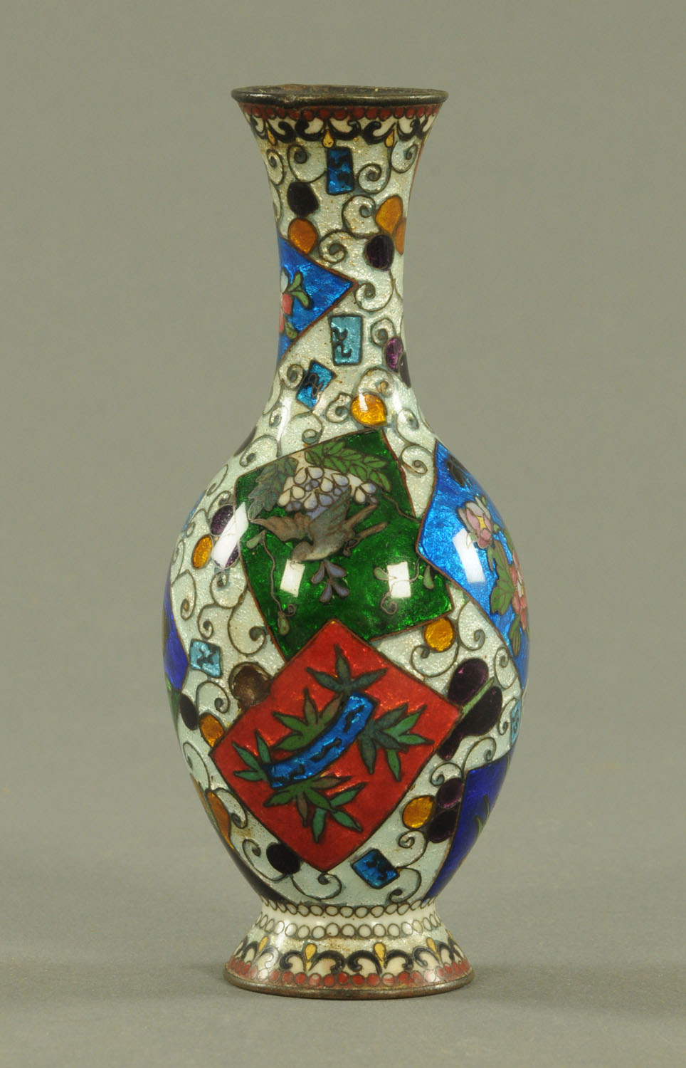 A Japanese Ginbari enamel vase, circa 1900, decorated with panels of birds and flowers.