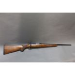 Ruger 77/22 Cal 22 Hornet bolt action rifle, with detachable magazine and wooden stock.