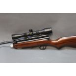 An SMK XS 79 CO2/88 Cal 22 CO2 charged air rifle, fitted with a BSA telescopic sight,