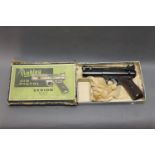 The Webley Senior 22 air pistol, with slanted brown grips, circa 1946-1958,