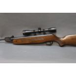Edgar Brothers model 60 Cal 22 break barrel air rifle, fitted with an SMK 4 x 40 telescopic sight.