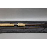 A Wychwood Sharp shooter spinning rod, in two sections, 9'.