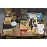 A boxed lot of vintage tins containing a Hardy spoon, Helical Devon minnow, quill minnows,