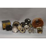 Twelve centre pin and fly reels, to include J.W. Young Pridex, Mallochs type side caster, etc.