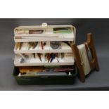 A large tackle box containing tackle, rapalas, tobies etc and a large wooden handline.