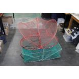 Two large crab traps. Height of red trap 60 cm.