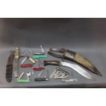A Kukri knife with 12" blade with sheath, together with 11 pocket knives, fixed blade knives,