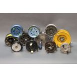 Eleven centre pin and fly reels, various makes and sizes.