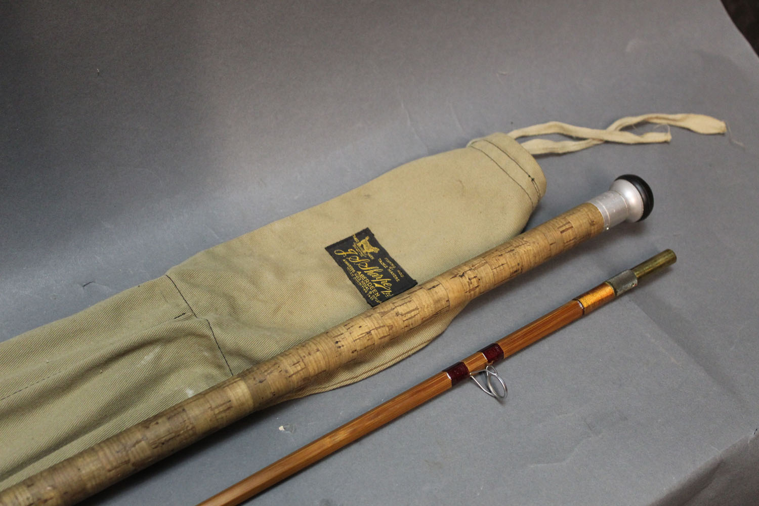 Sharpes of Aberdeen, a split cane spinning rod titled "The J S Sharpe", in two sections, 9' 3".