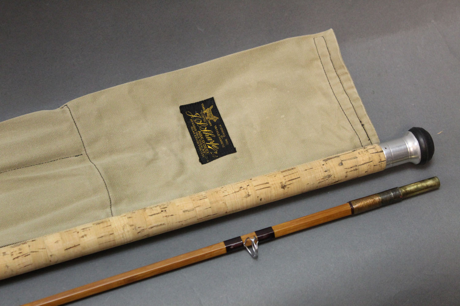 A Sharpes of Aberdeen JS Sharpe Scottie split can spinning rod, in two sections, 9'.