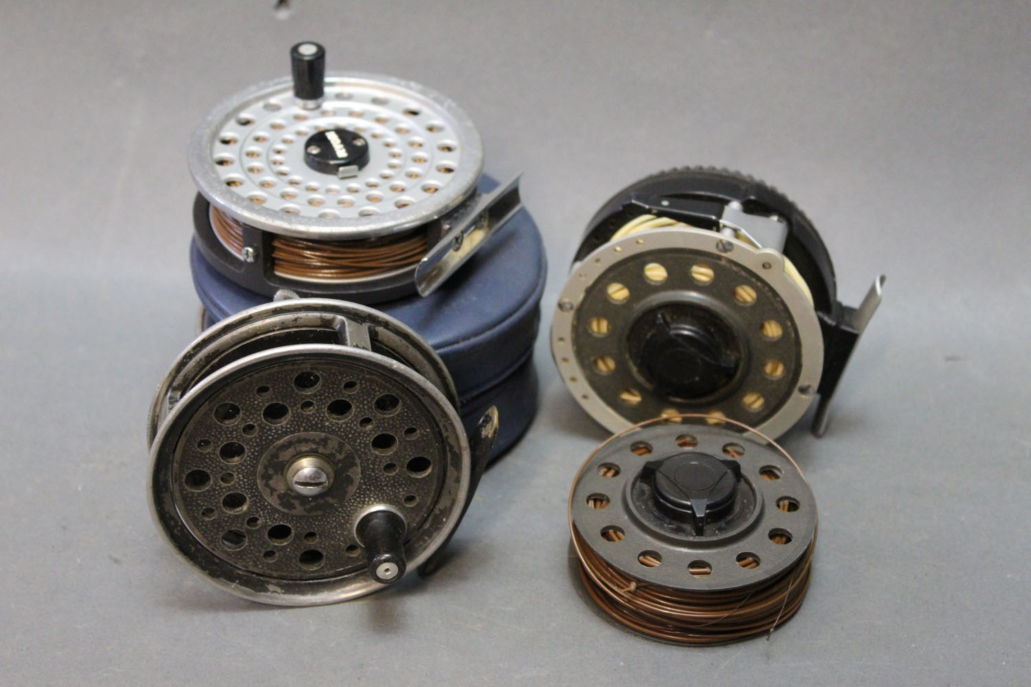 Three trout fly fly reels, a Garcia Mitchell 710 automatic with spare spool,