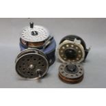 Three trout fly fly reels, a Garcia Mitchell 710 automatic with spare spool,