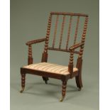 A 19th century bobbin turned chair, with striped and floral upholstered seat,